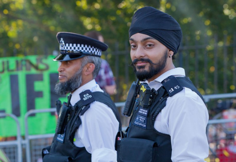 Two police officers standing outside.